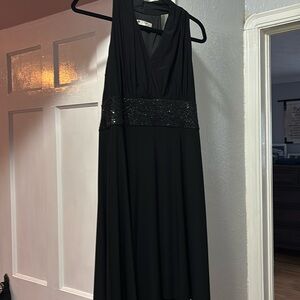 Dressy sleeveless black dress with sequined waist. 10P